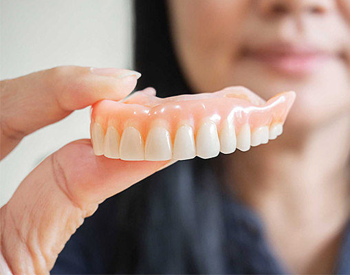 Dentures are custom-made dental appliances used to replace missing teeth and restore both function and appearance.